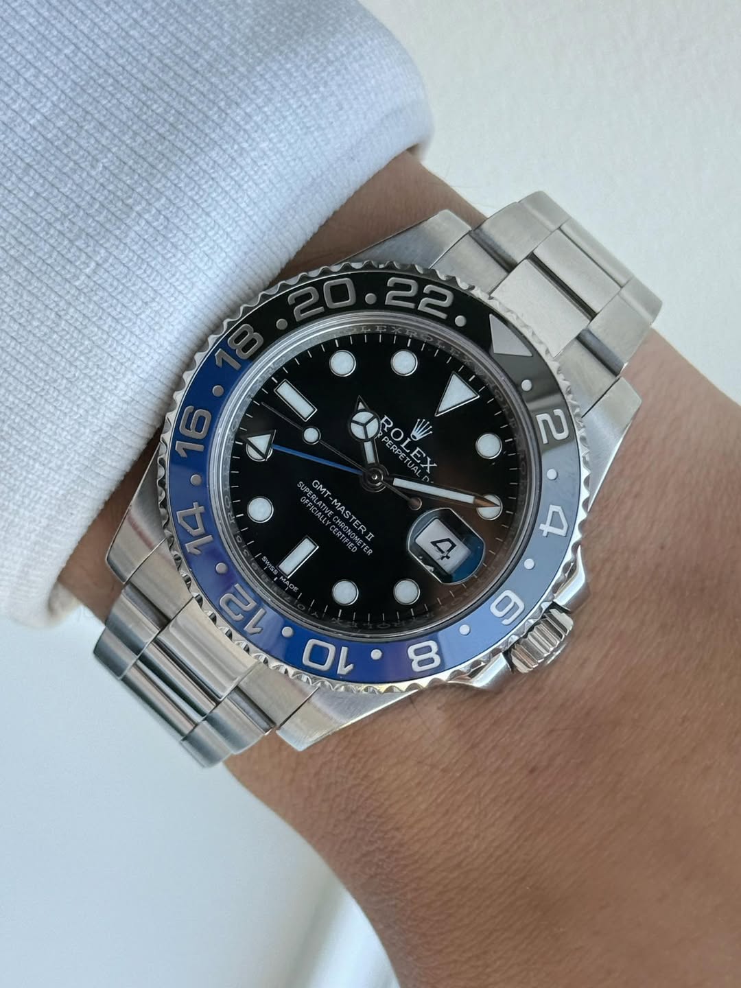 May be an image of wrist watch and text