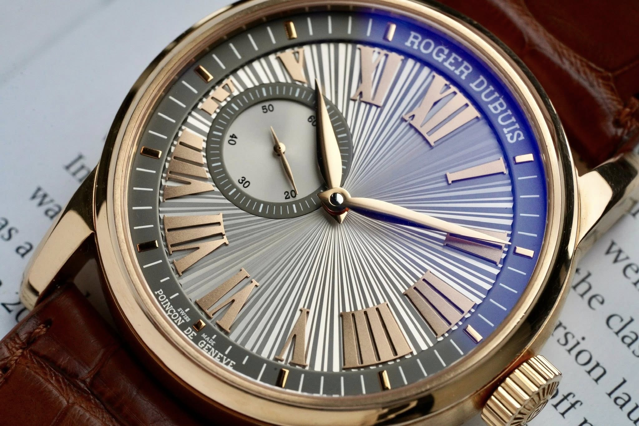 May be an image of wrist watch and text that says '50 ዐኑ ROGER ROGER DUBUI DUBUIS ဝင် I wa sa S ص POINCON SWISS DE GENEVE MAD Abr GENEVE we we he rsion sion cla. ff la'