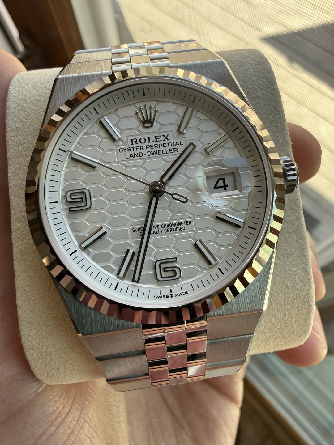May be an image of wrist watch and text that says '7שי ROLEX OYSTER PERPETUAL ROLETUAL TUAL LAND-DWELLER LAND -DWELLER DWE 9 CHRONOMETER TER CHRONOMET IALLY ALLYCERTIFIED…