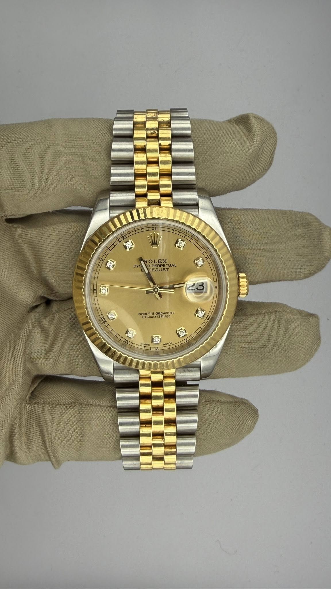 May be an image of wrist watch and text