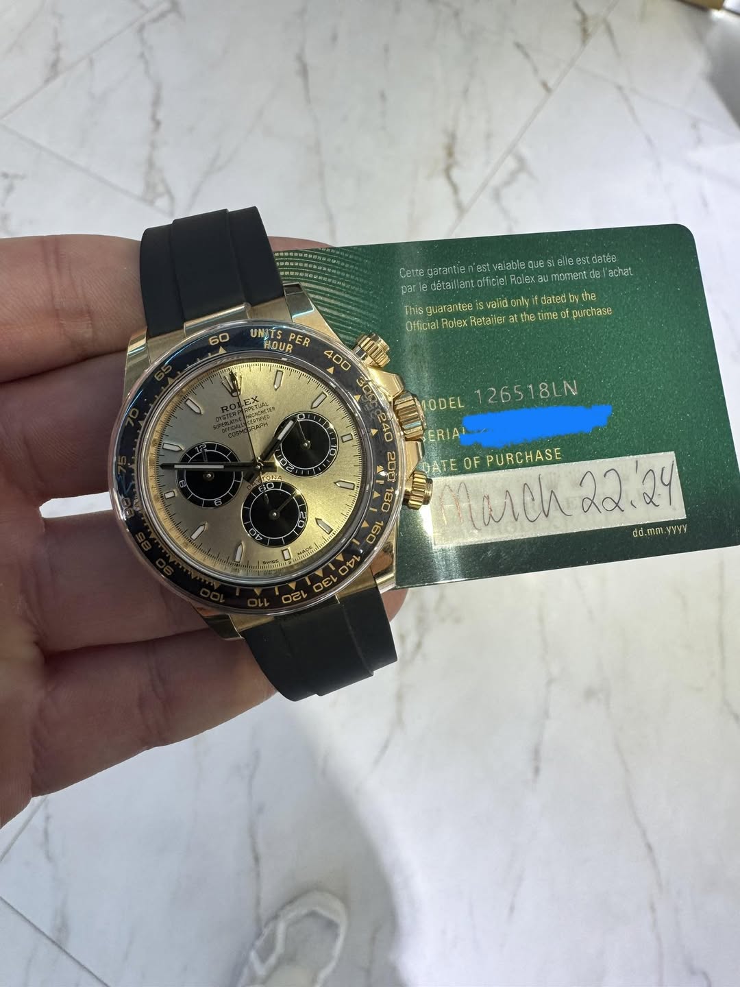 May be an image of wrist watch and text