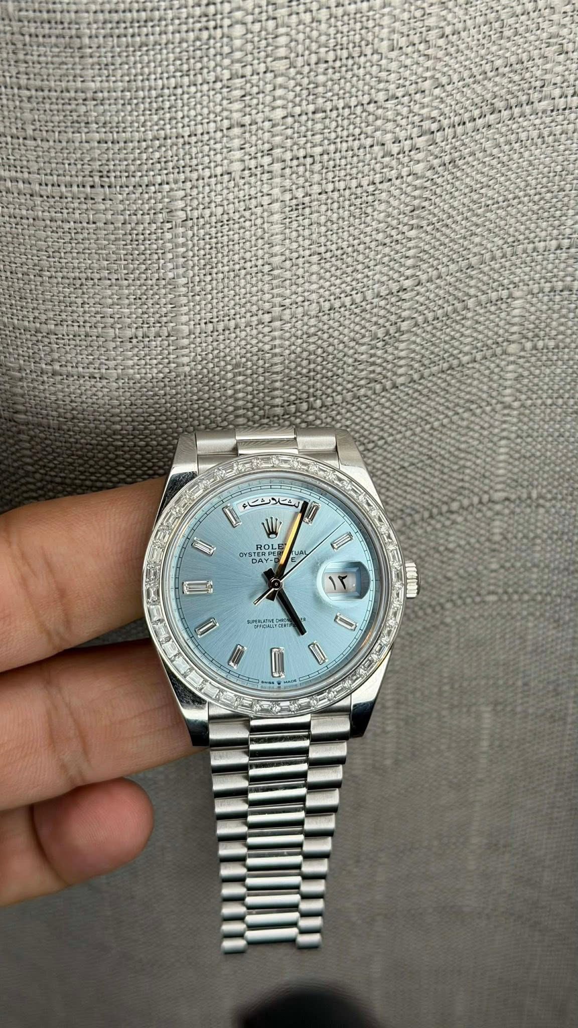 May be an image of wrist watch and text
