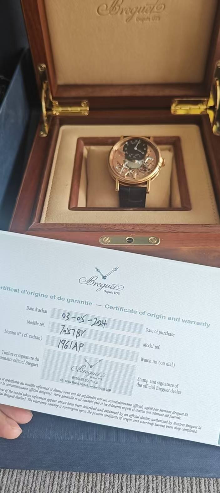 May be an image of wrist watch and text