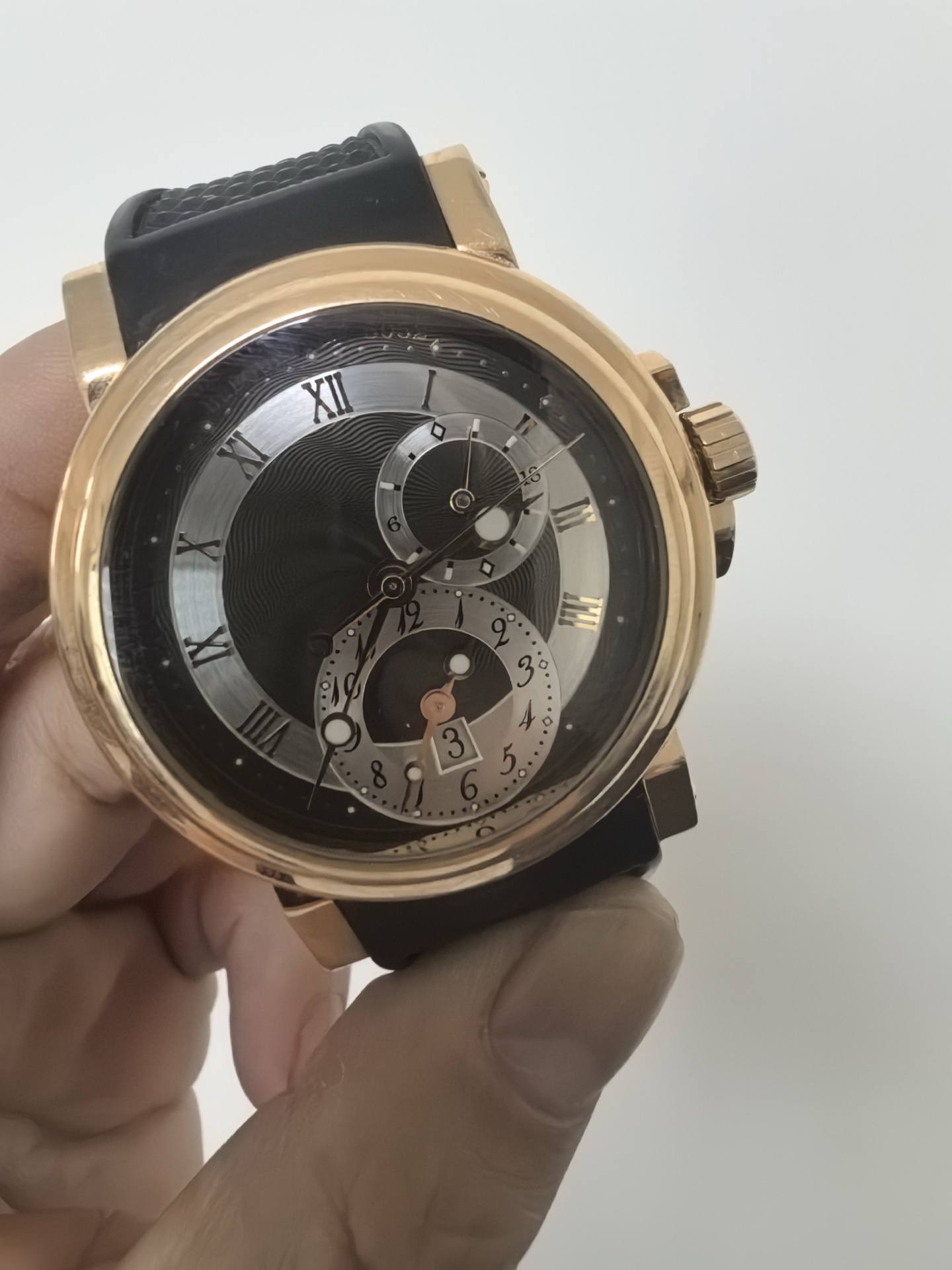 May be an image of wrist watch and text