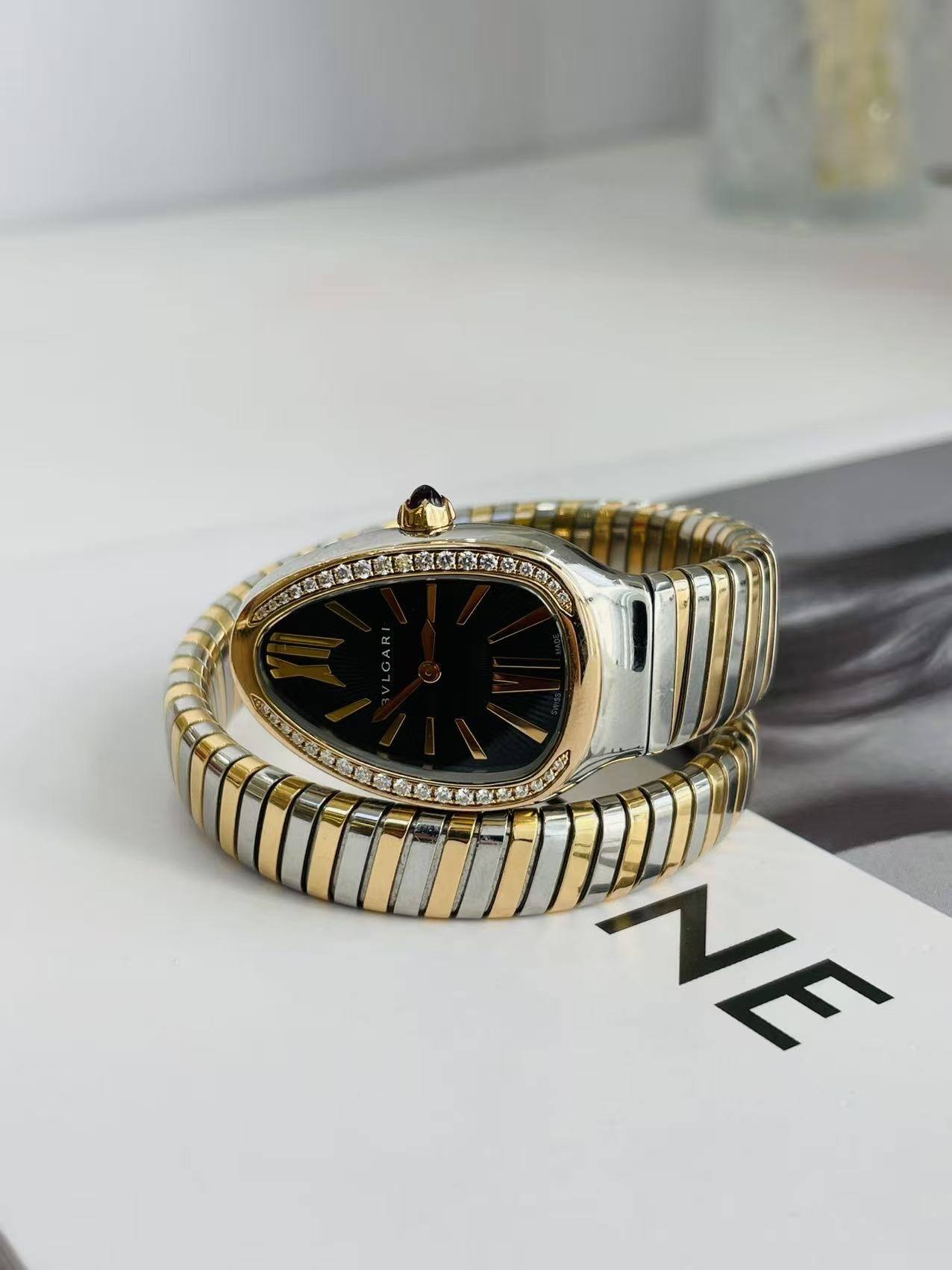May be an image of wrist watch, jewelry and text
