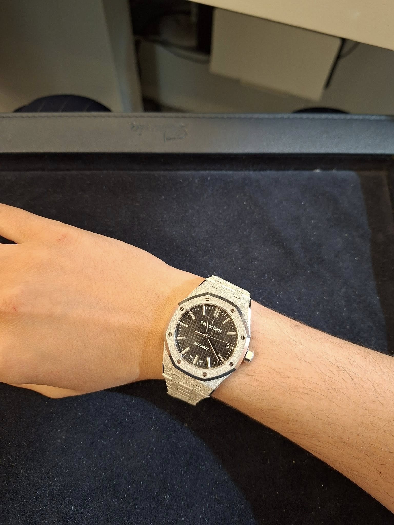 May be an image of wrist watch and text