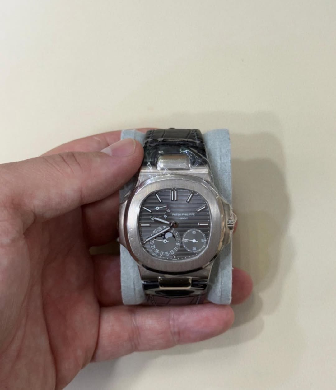 May be an image of wrist watch and text