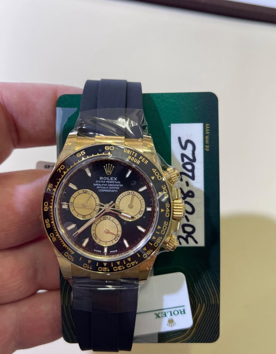 May be an image of wrist watch and text