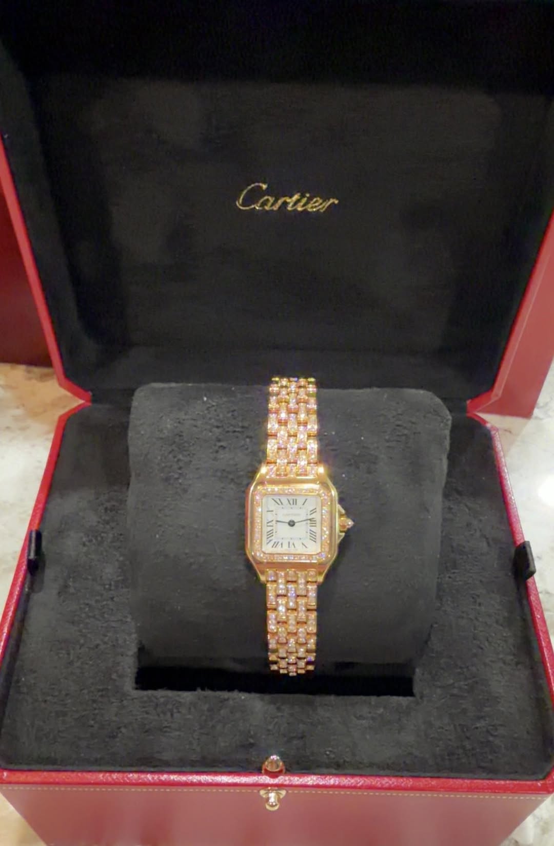 May be an image of wrist watch and text that says 'Cartier 佟 II'