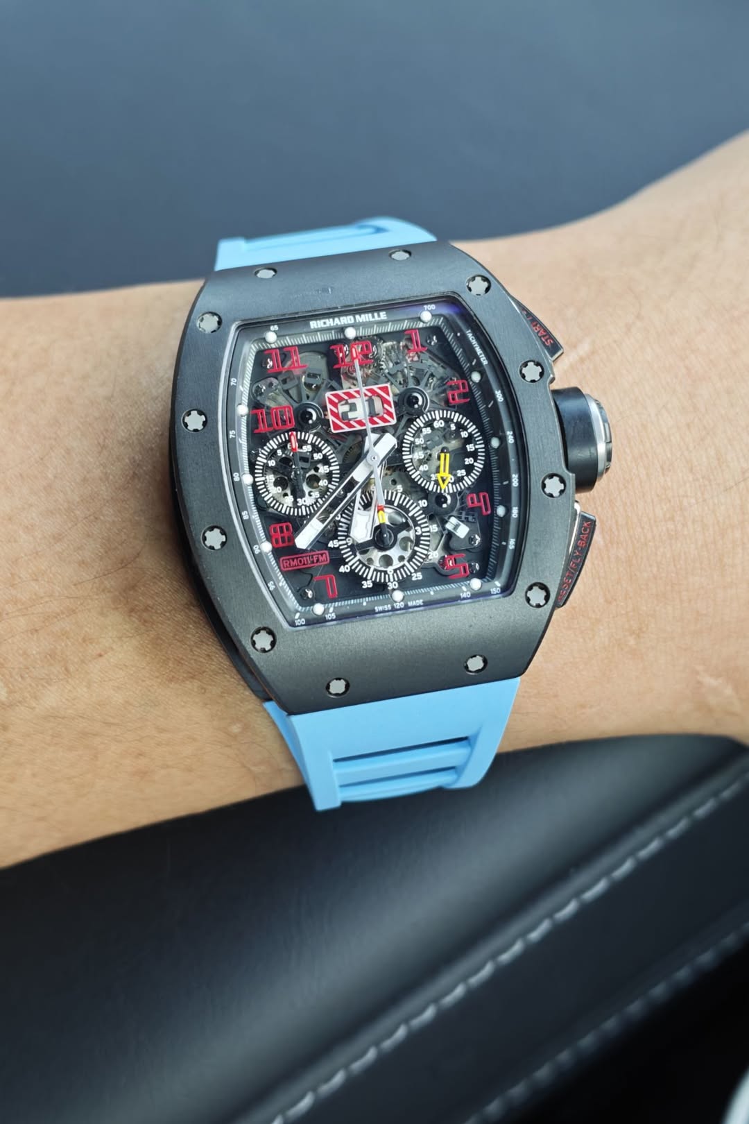 May be an image of wrist watch and text