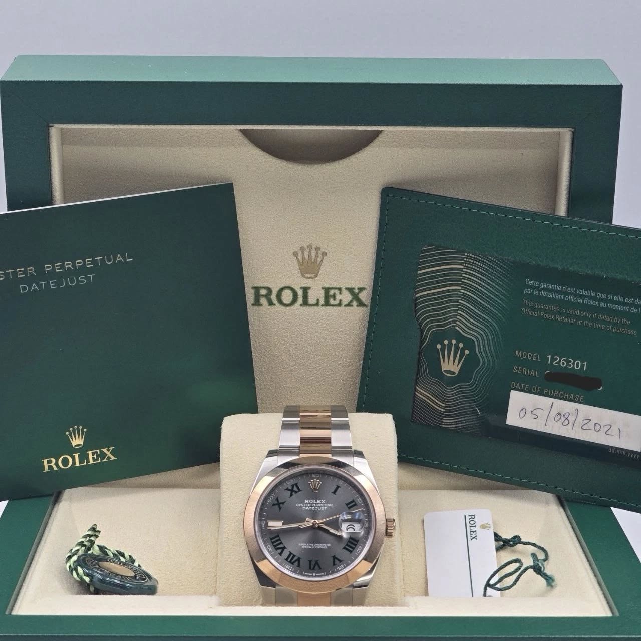 May be an image of wrist watch and text that says 'TER RPERPETUAL AL DATEJUST DATE JUST زك ROLEX 126301 ROLEX 05 08/ KOLKX 대 m.m ILAU XΊΌΗ መቨበ 형'