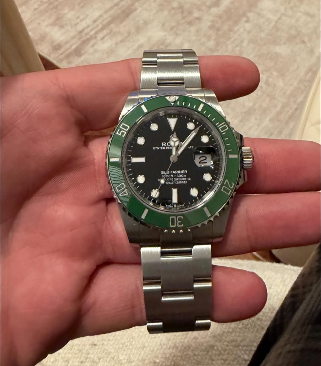 May be an image of wrist watch and text
