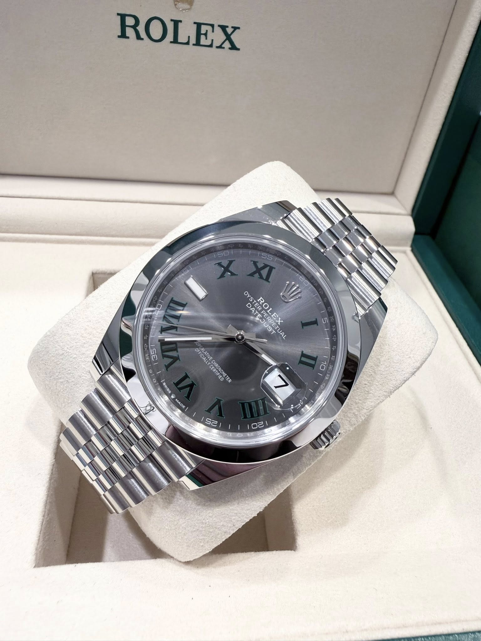 May be an image of wrist watch and text
