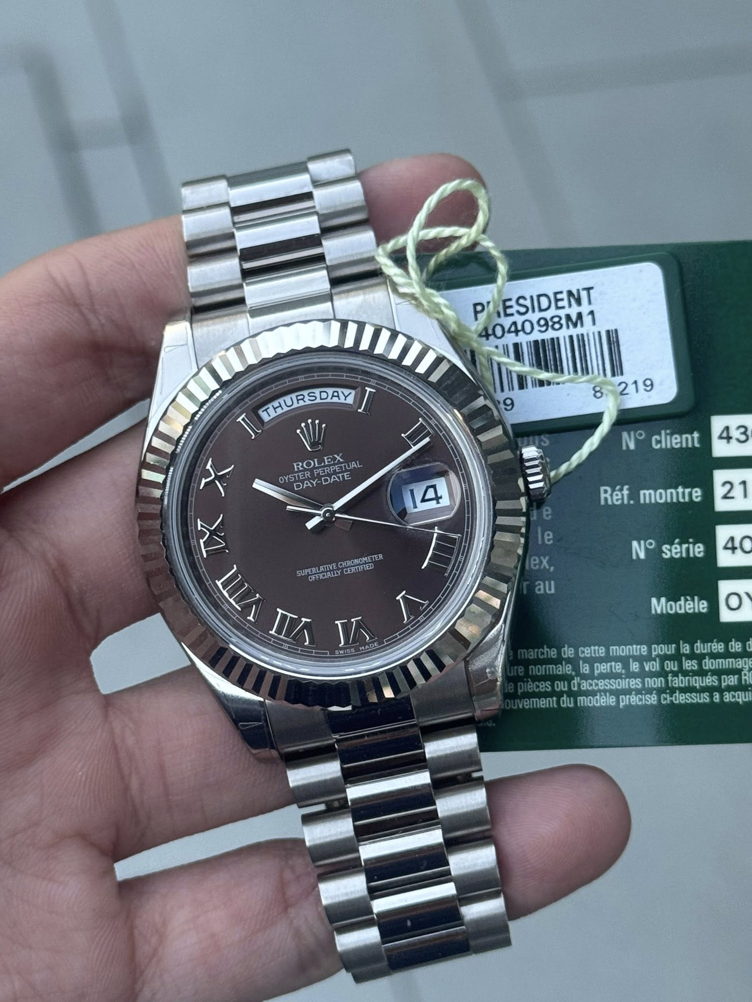 May be an image of wrist watch and text that says 'P PRESIDENT 404098M1 8:219 ROLEX DAY DATE N° client 43 14 THURSDAY I JU X TX Υπ y J Réf. montre SEHORLE 21 TII N° série 40 au…