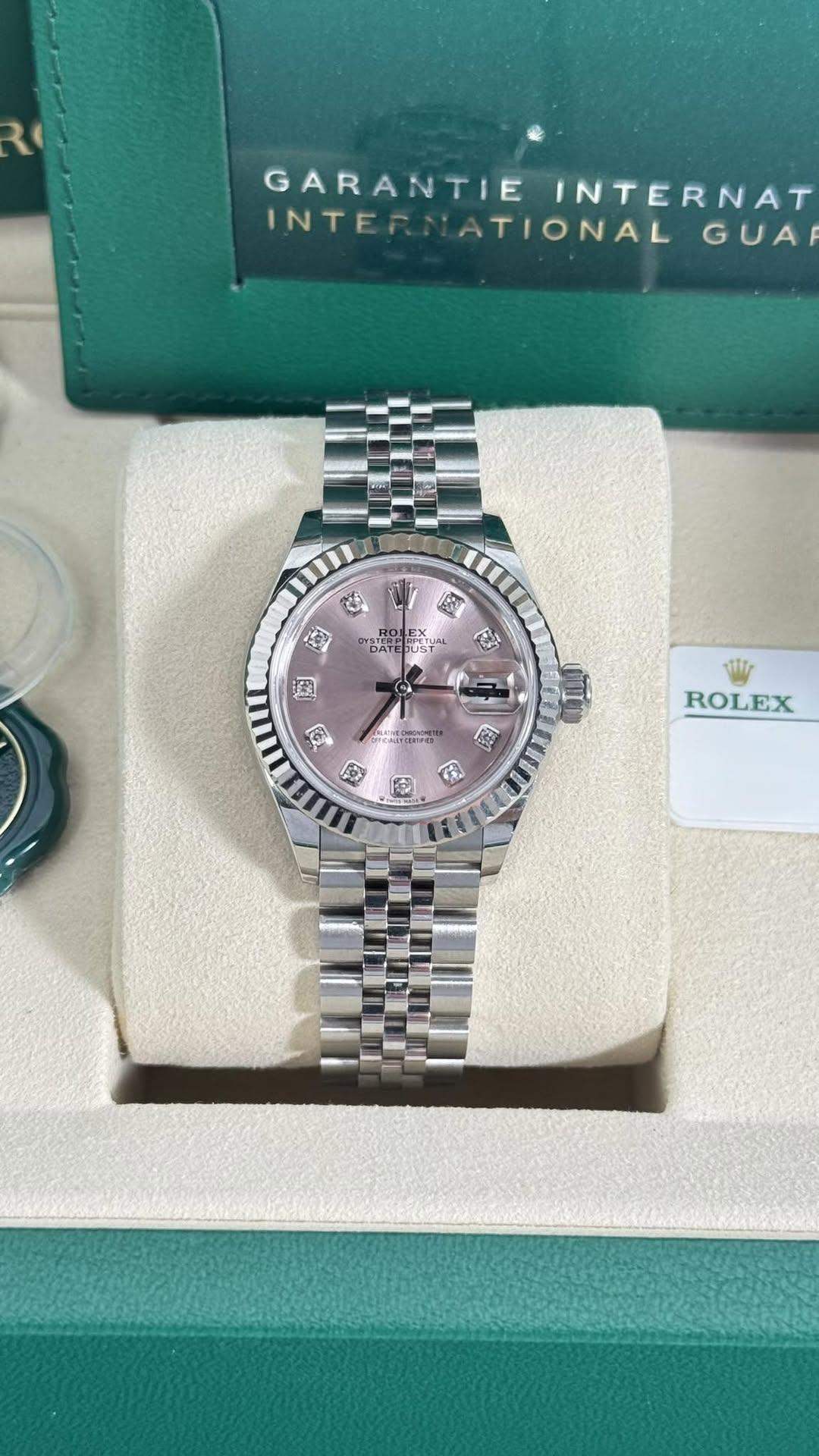 May be an image of wrist watch and text