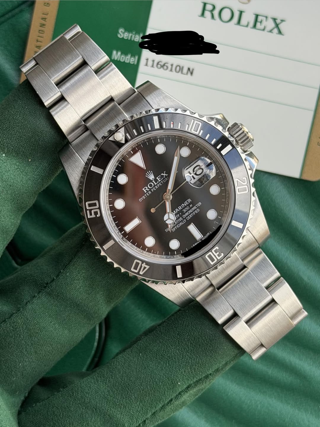 May be an image of wrist watch and text that says 'TIONAL Serial Model 116610LN ROLEX 10 I ROLE ROTSPE SESPE PERPE OYST YSTER 50 20 ARINER PASONOMETE 00P ETER CERTIFIED SATIVE…