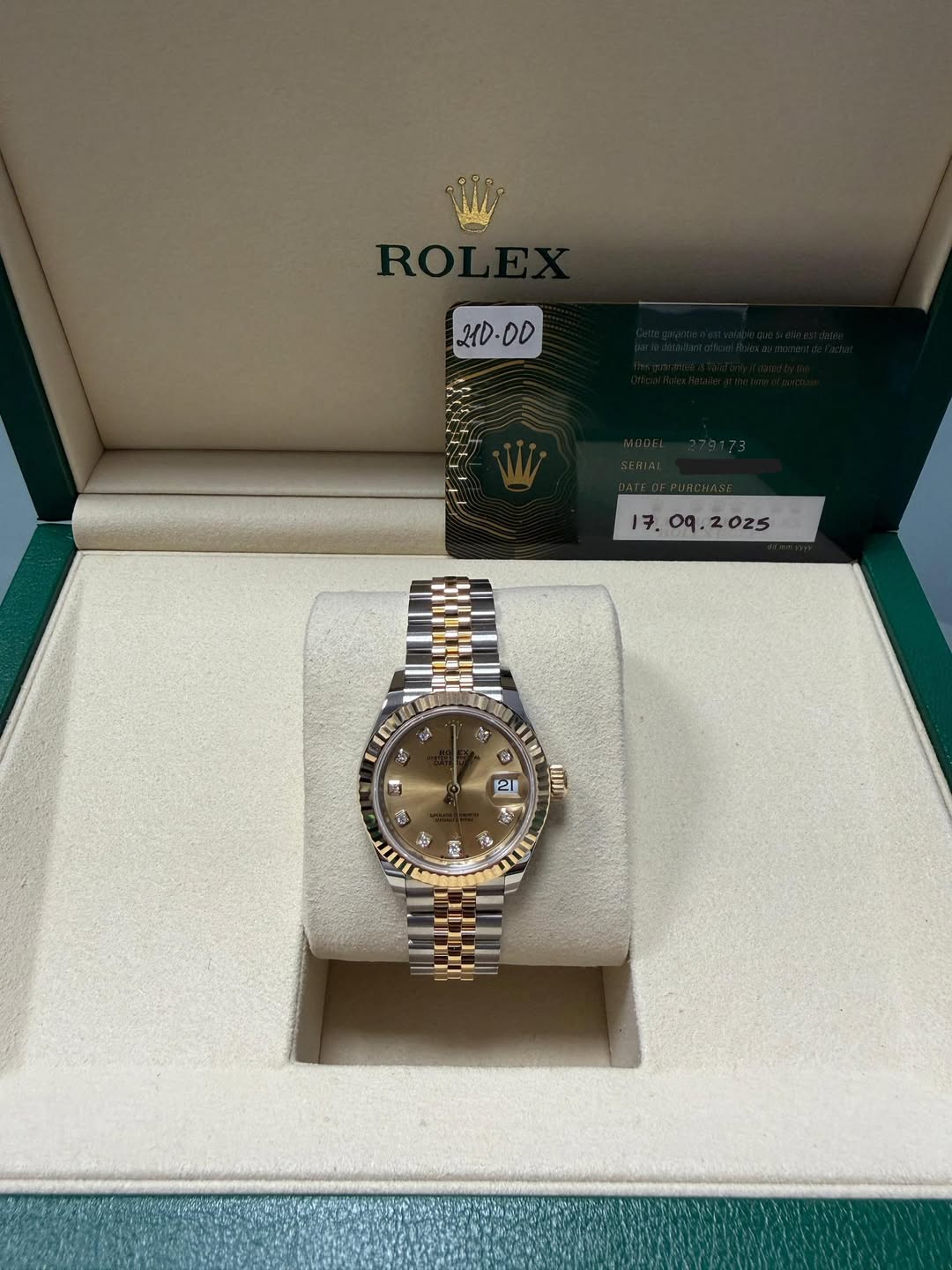 May be an image of wrist watch and text that says '21D 21D-00 DD . o9. .2025 ባና el 5្គ LIW 21 2 4 B ប្ 2 ال'