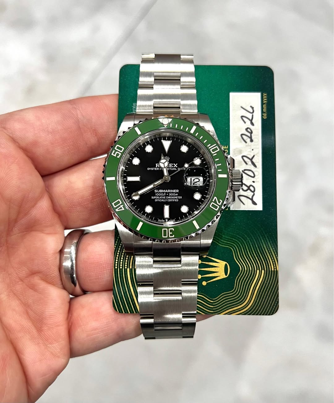 May be an image of wrist watch and text