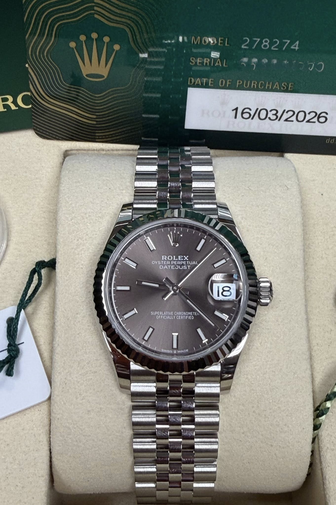 May be an image of wrist watch and text