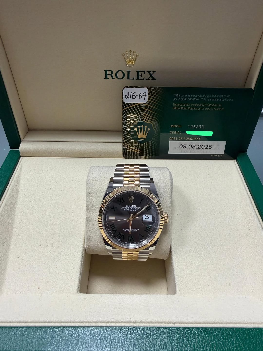 May be an image of wrist watch and text