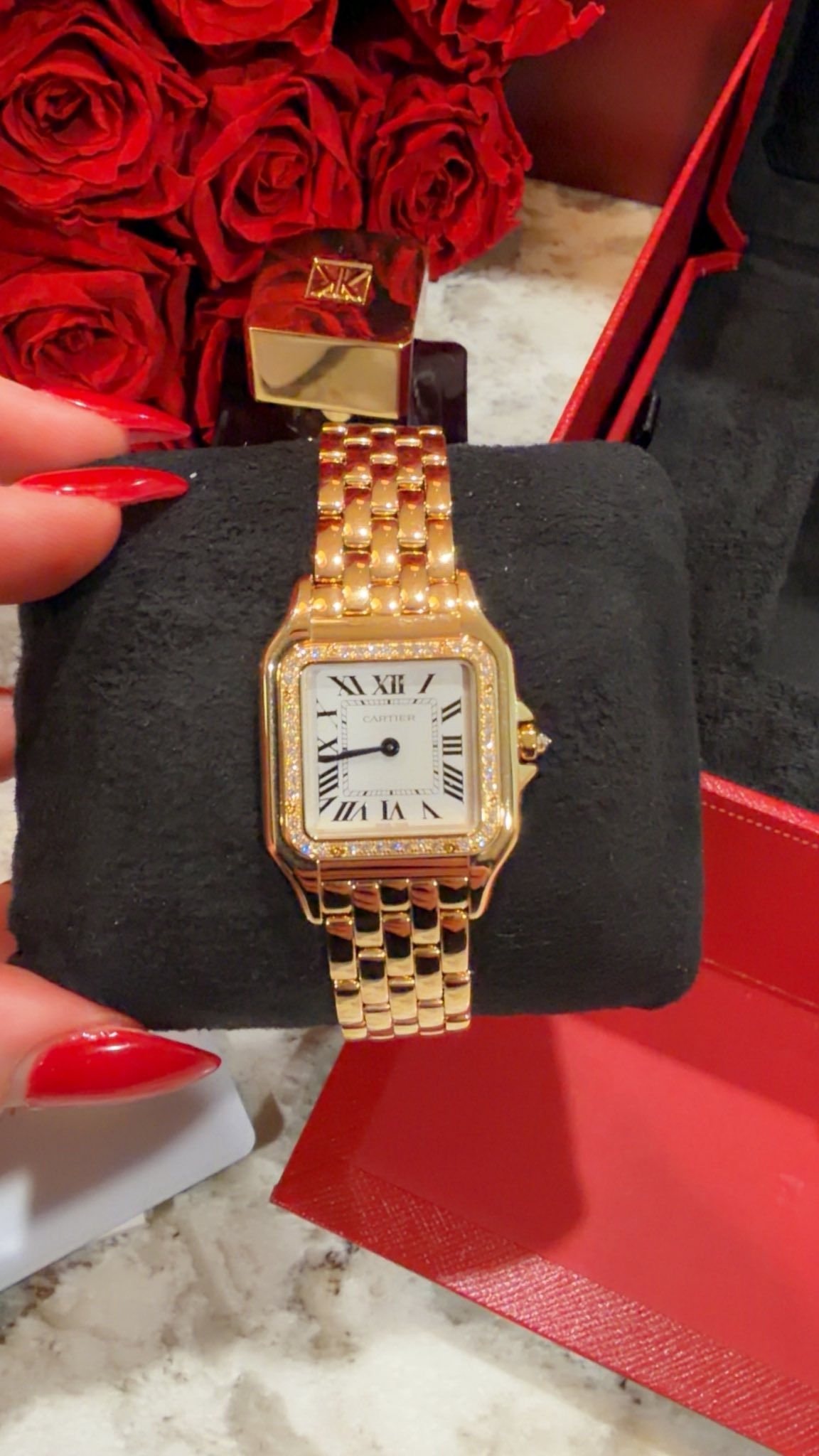 May be an image of wrist watch and text