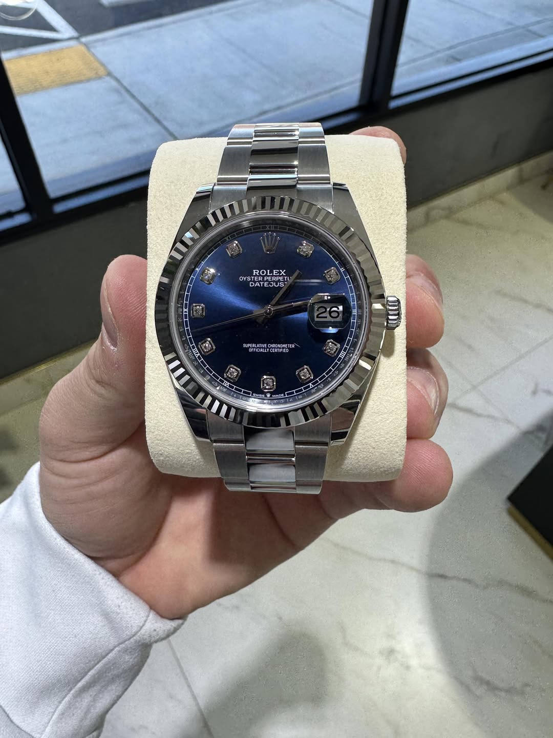 May be an image of wrist watch and text