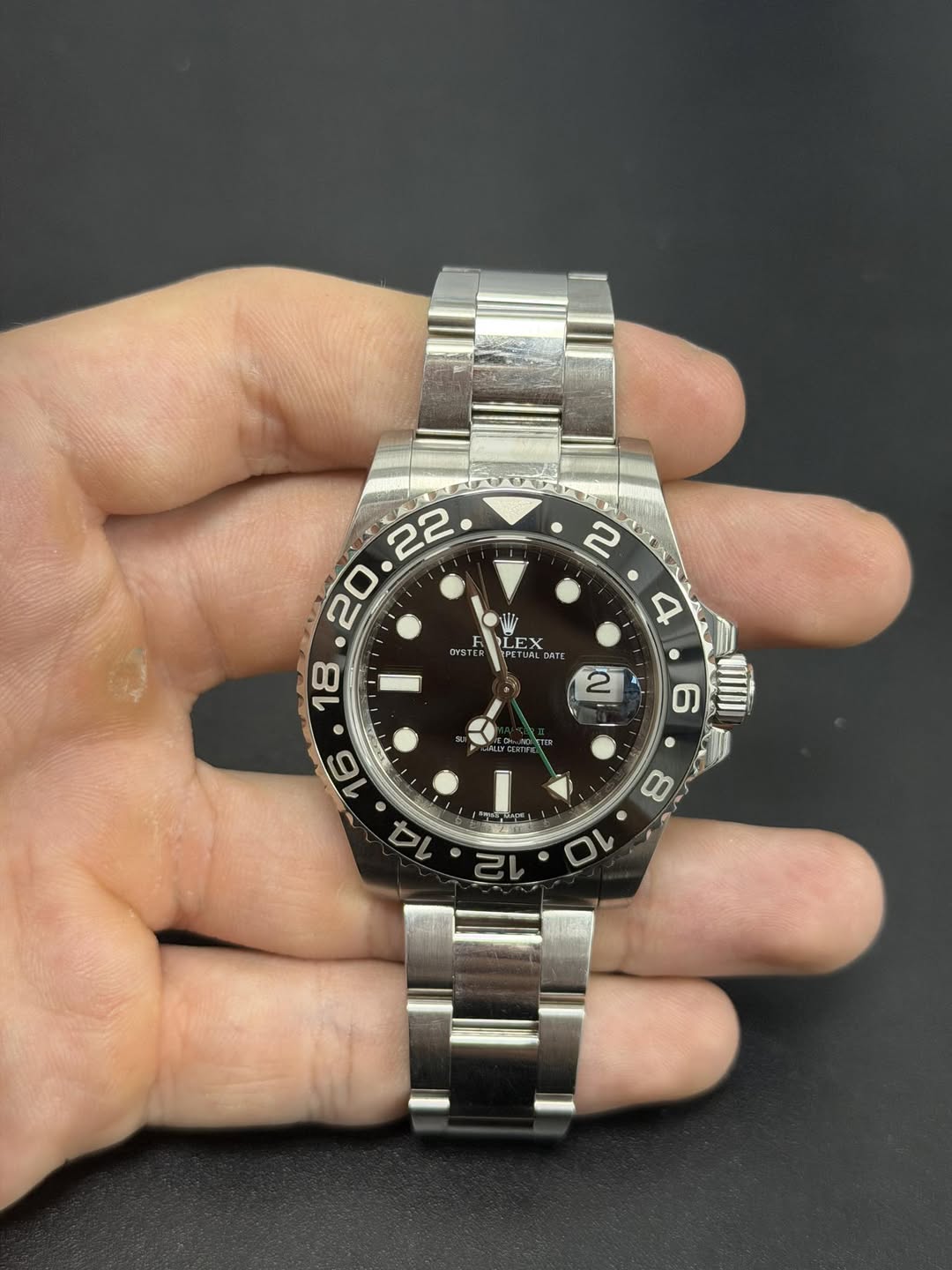 May be an image of wrist watch and text