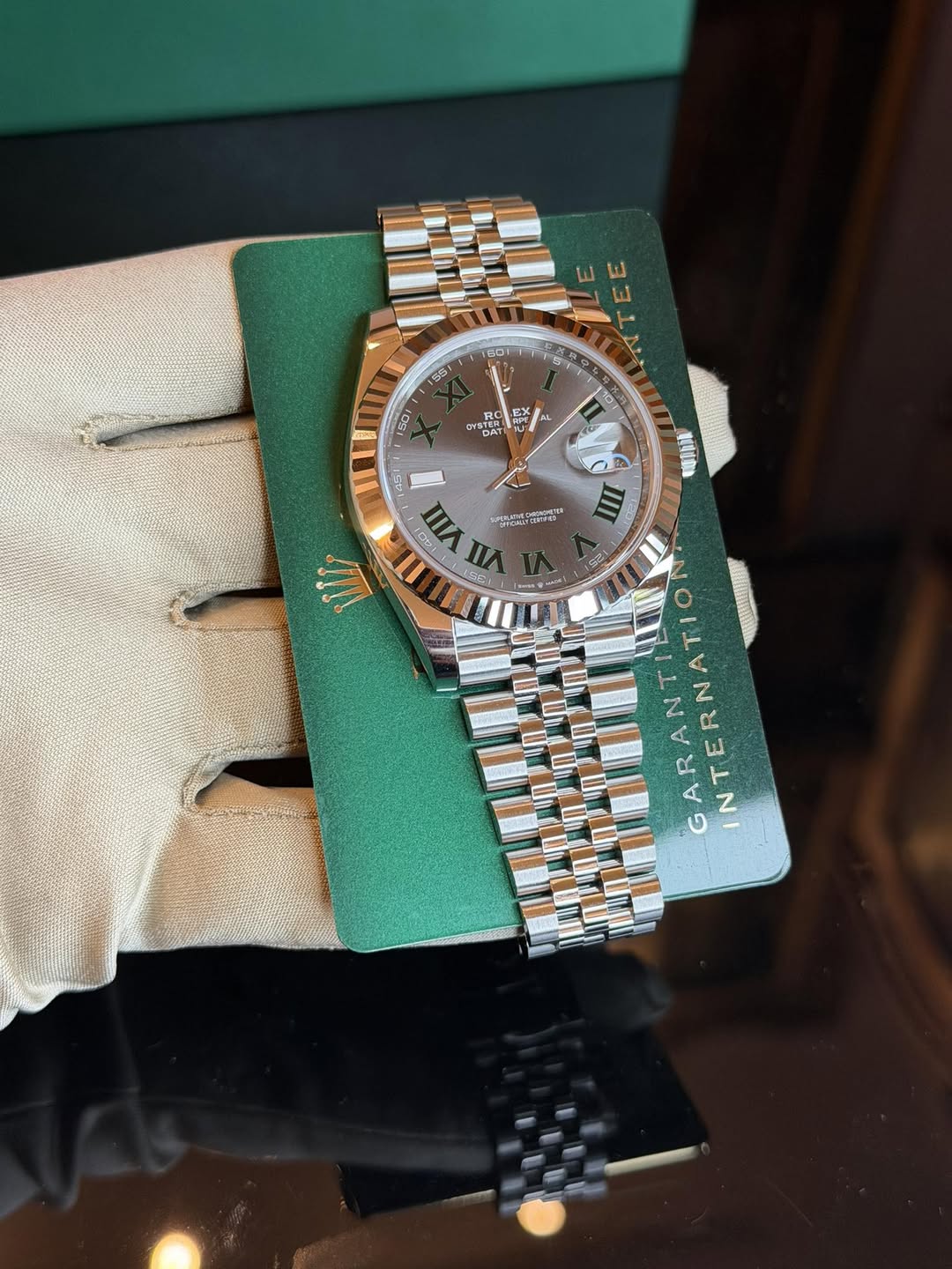 May be an image of wrist watch and text