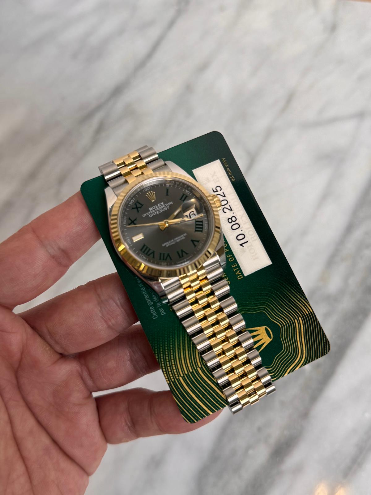 May be an image of wrist watch and text
