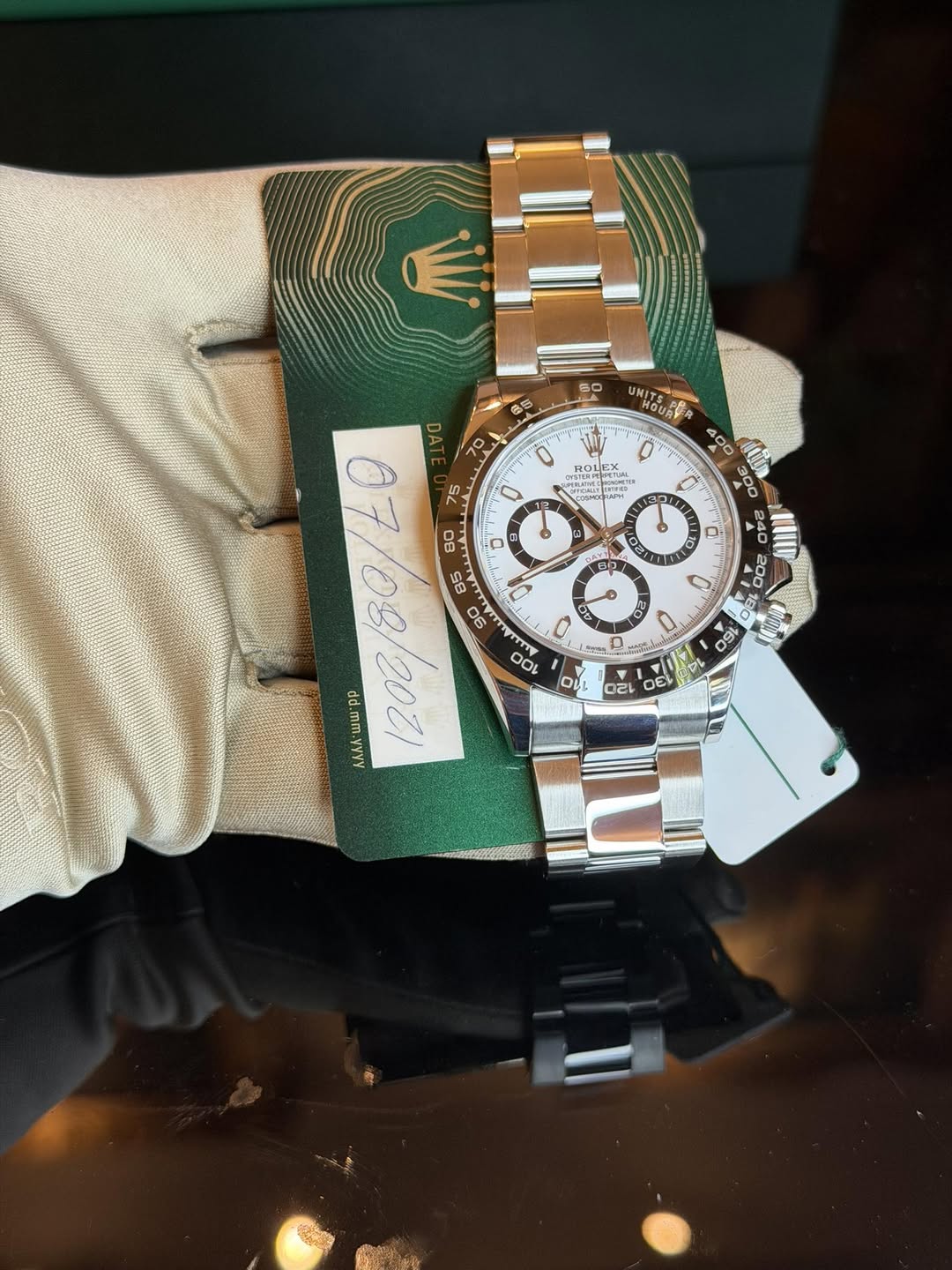 May be an image of wrist watch and text