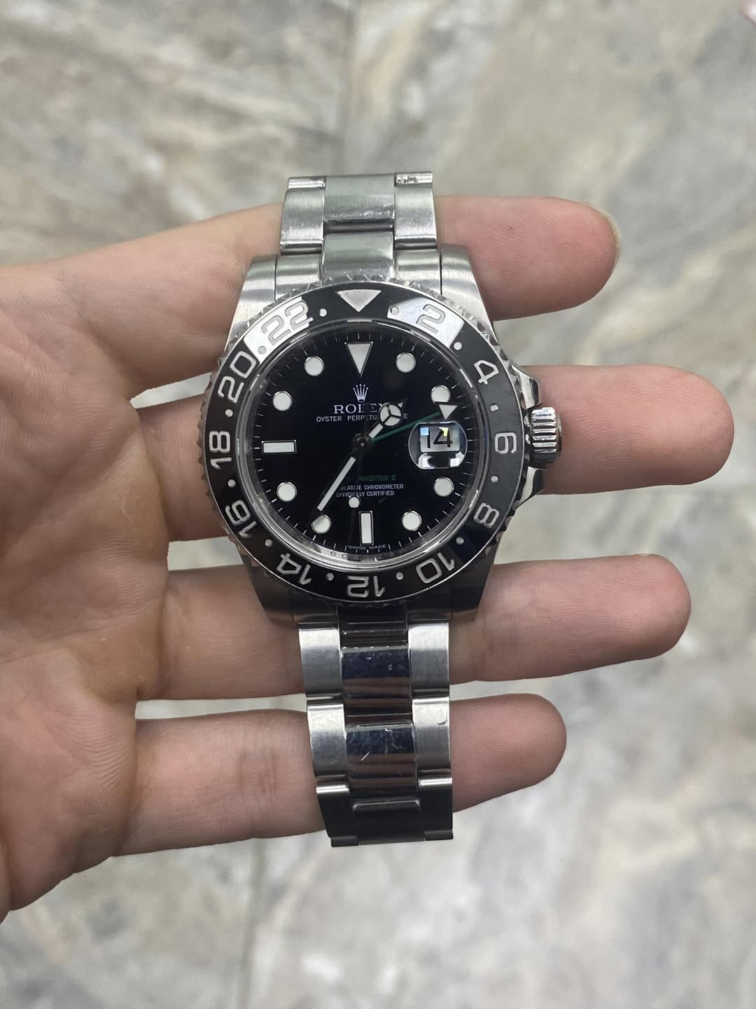 May be an image of wrist watch and text