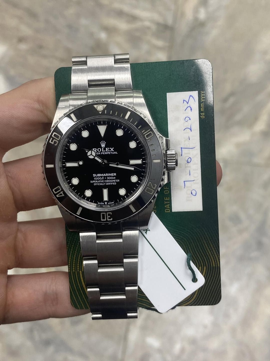 May be an image of wrist watch and text