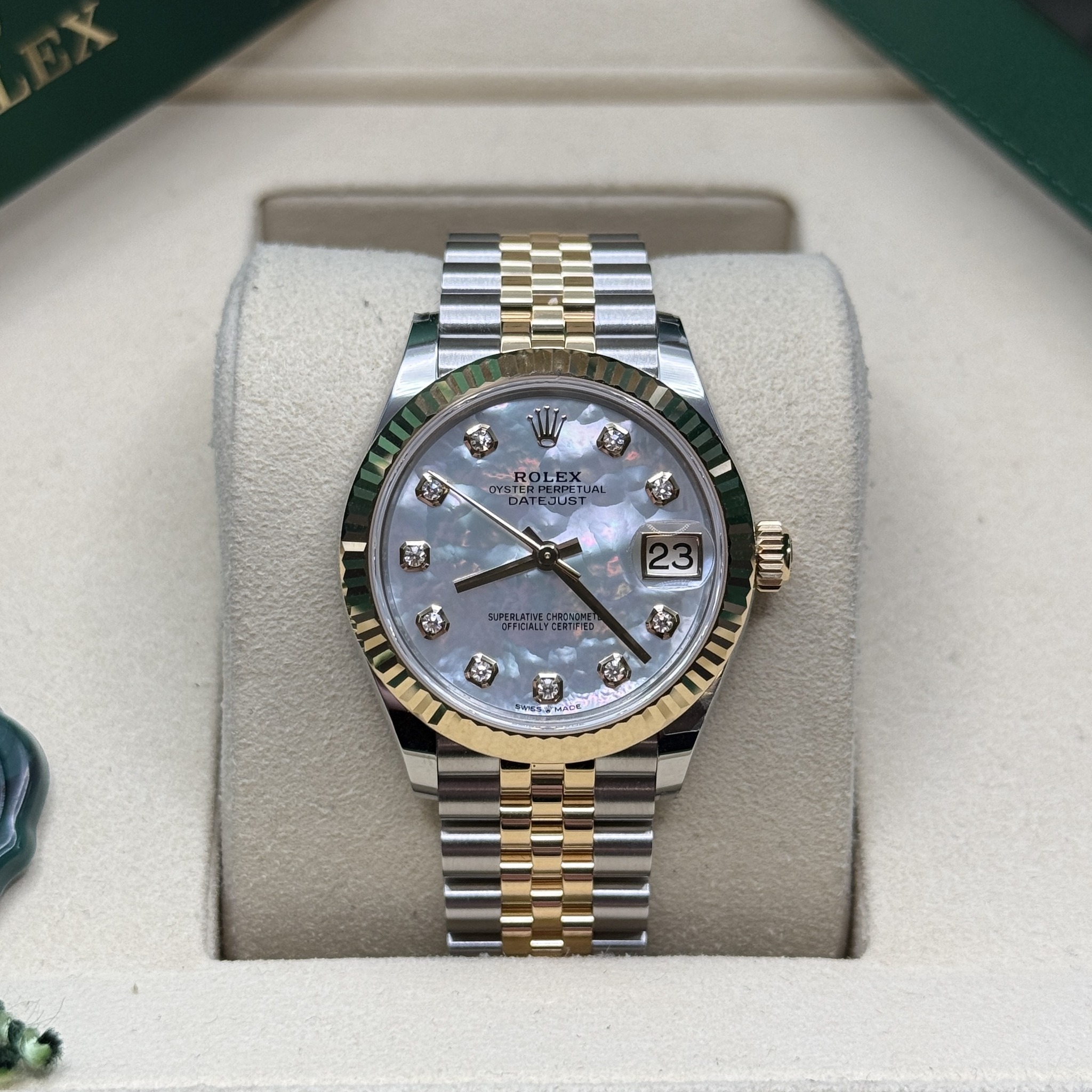 May be an image of wrist watch and text