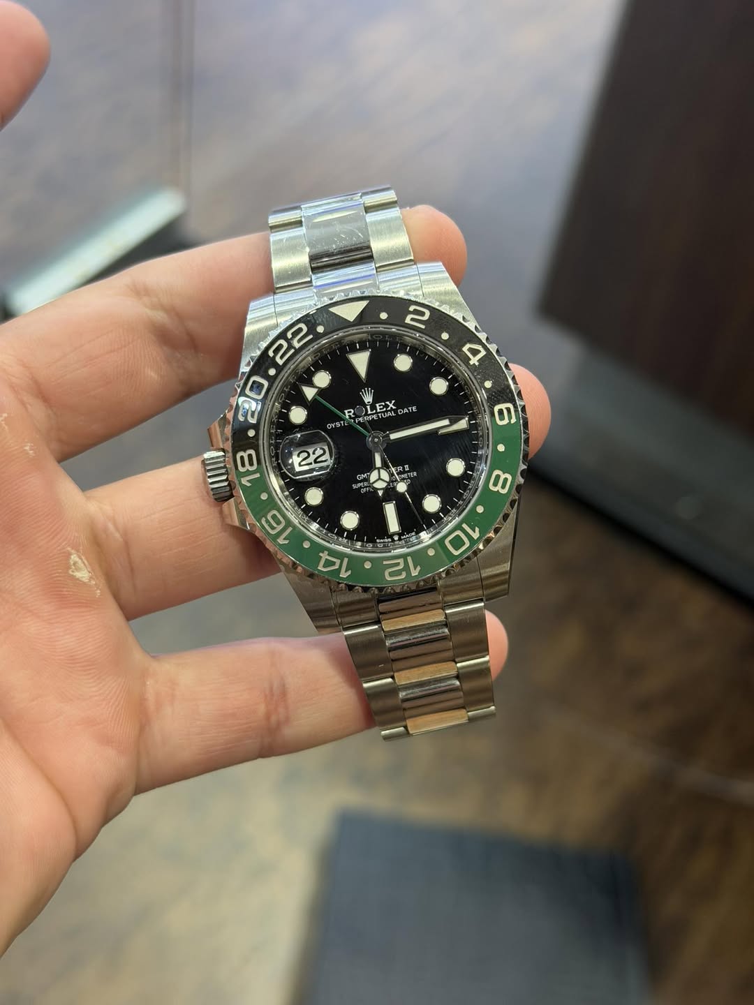 May be an image of wrist watch and text