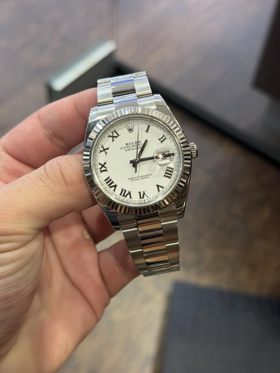 May be an image of wrist watch and text
