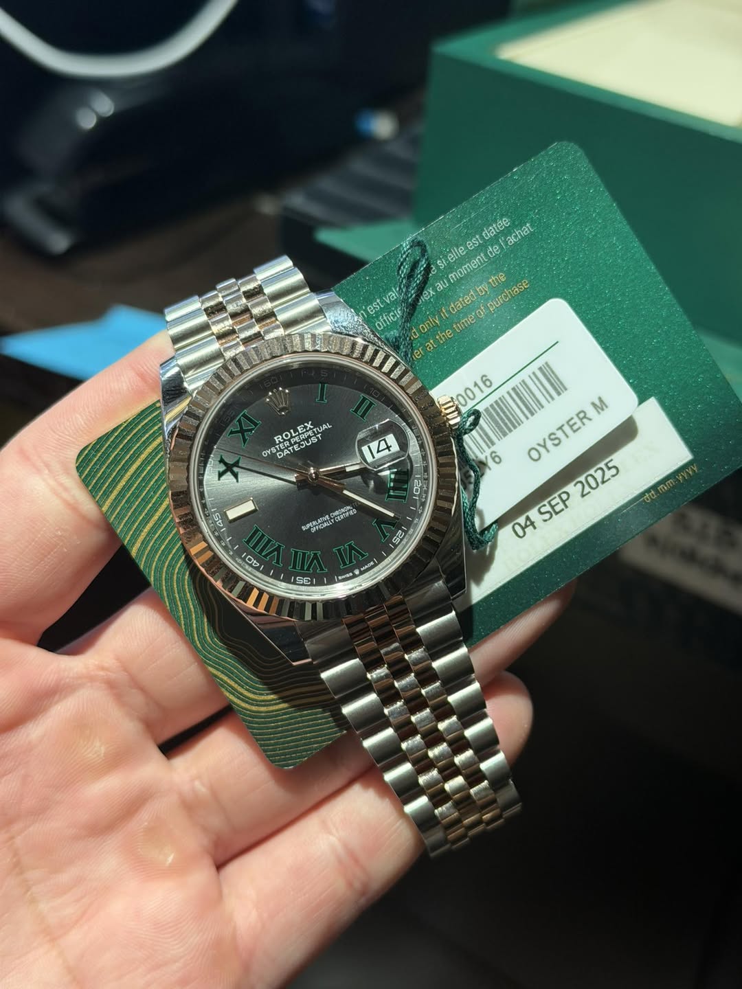 May be an image of wrist watch and text