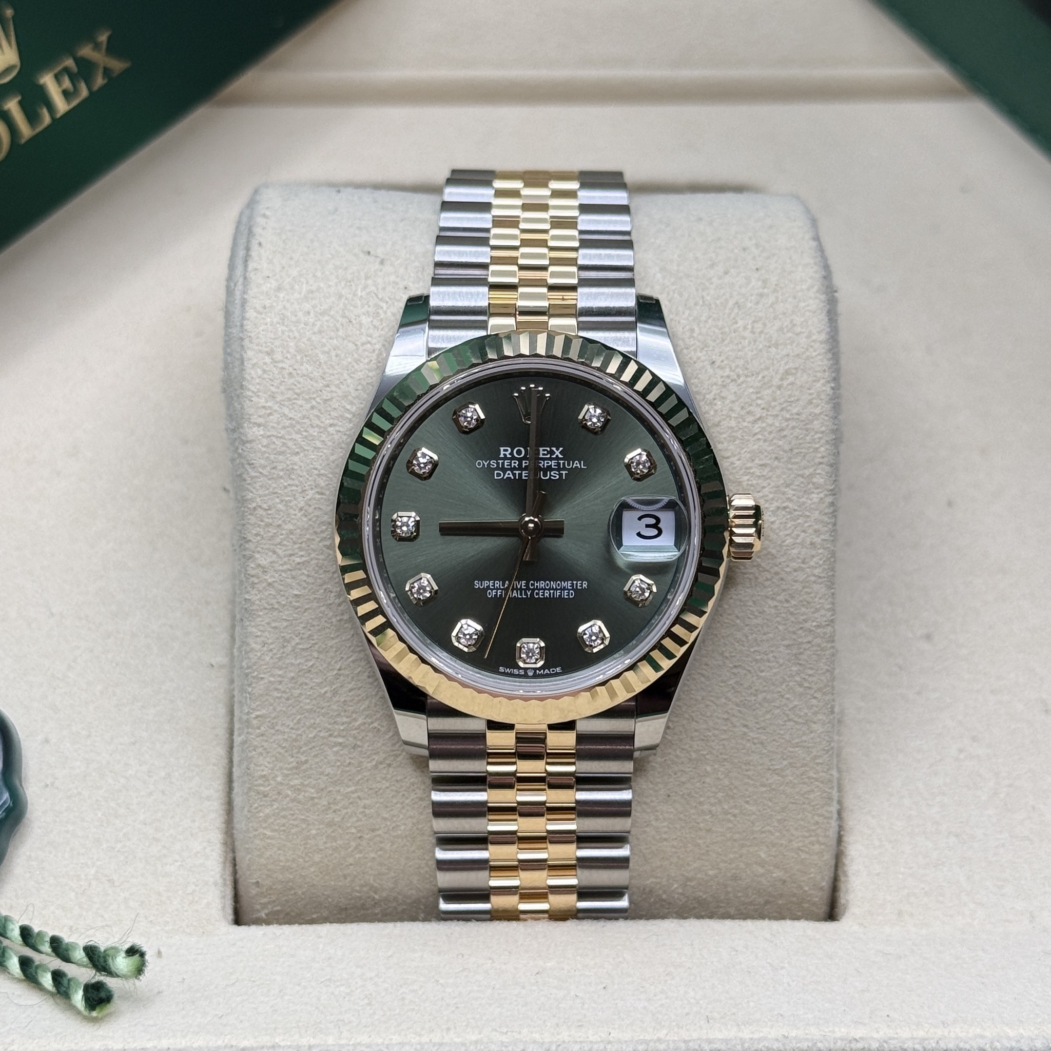 May be an image of wrist watch and text