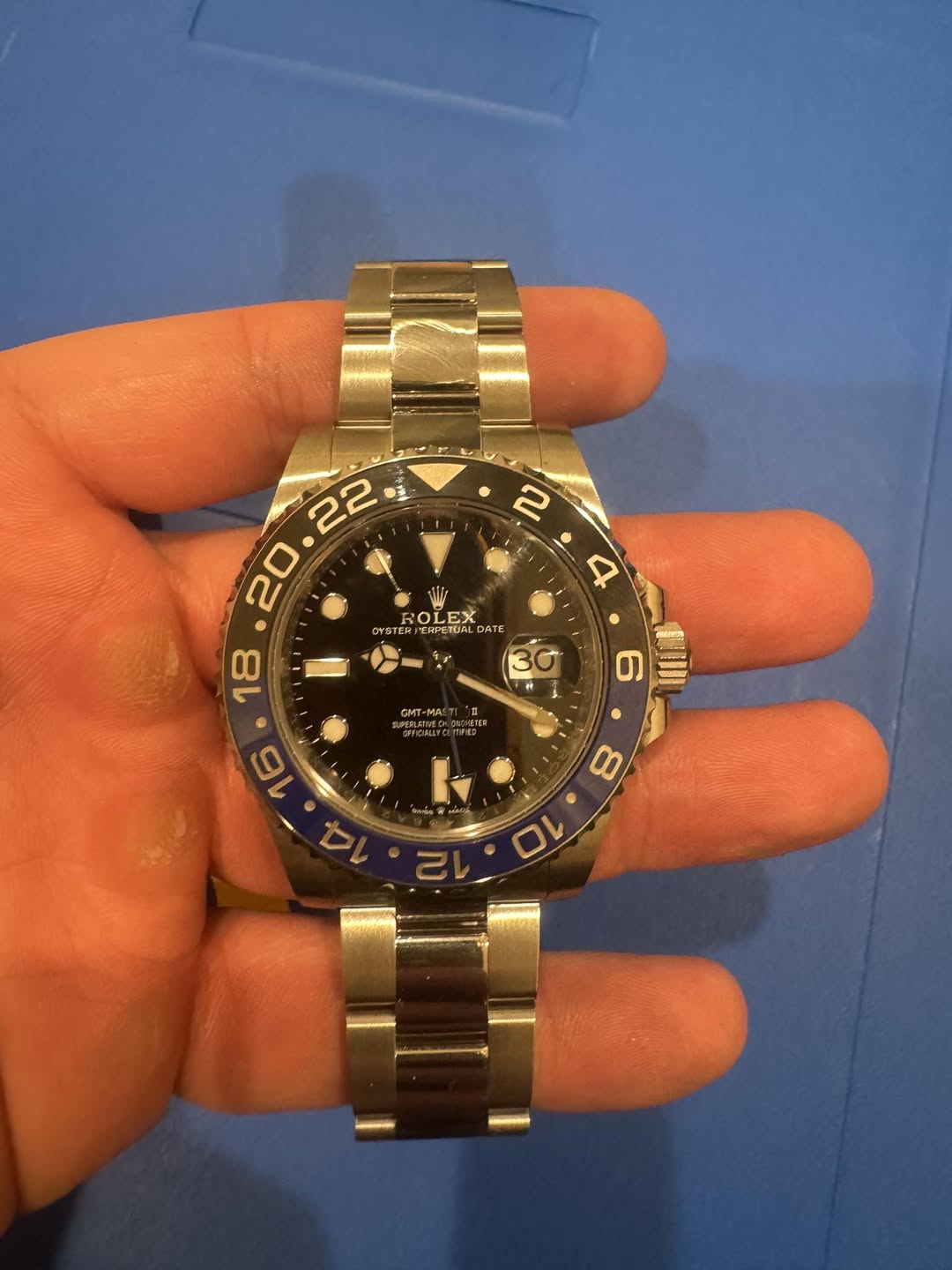 May be an image of wrist watch and text