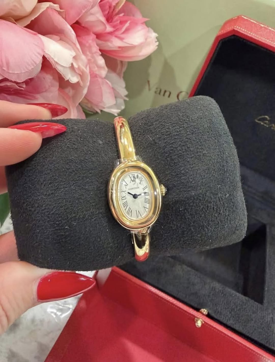 May be an image of wrist watch and text