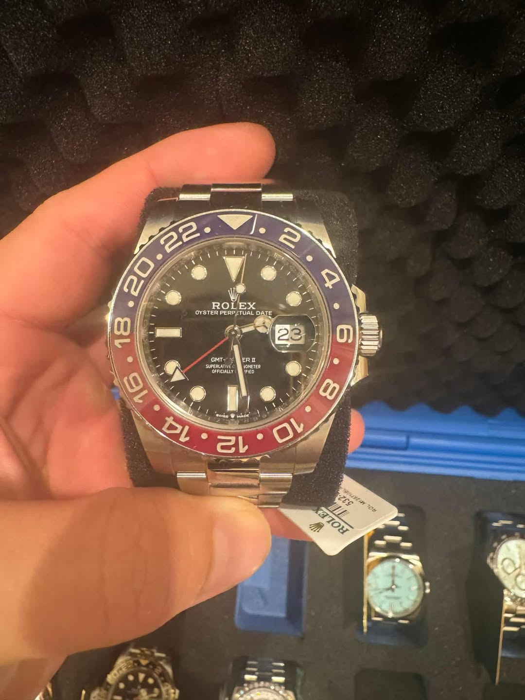 May be an image of wrist watch and text