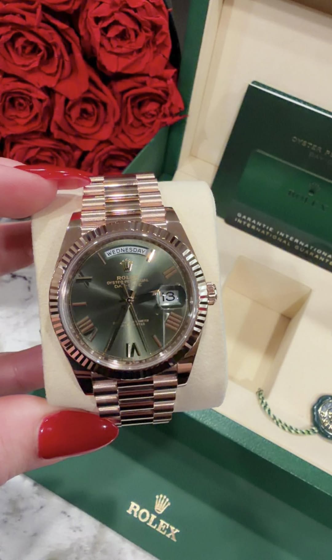 May be an image of wrist watch and text that says 'WEDNESDAY DAY 13 ROLEX ROLEX'