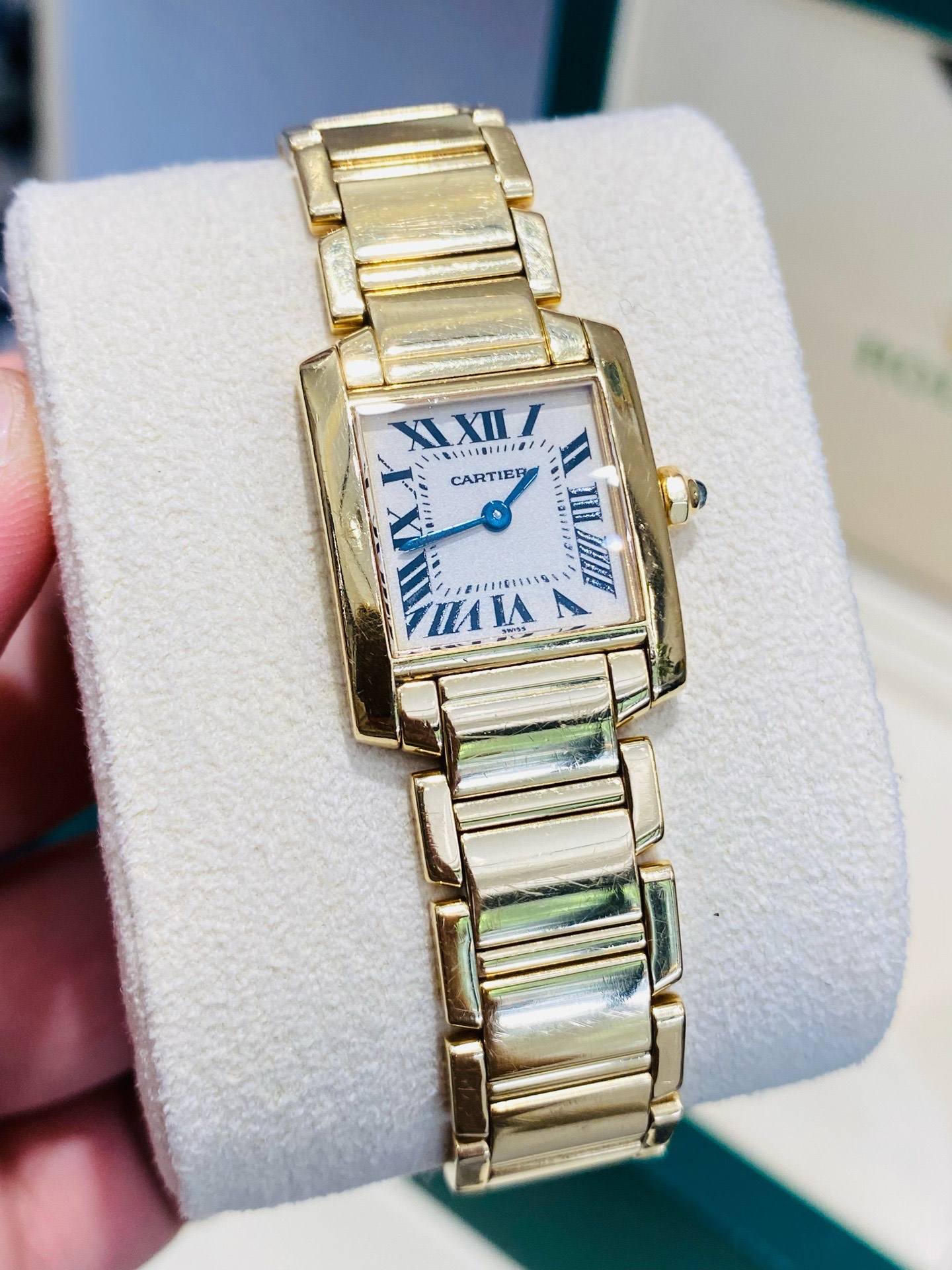 May be an image of wrist watch and text