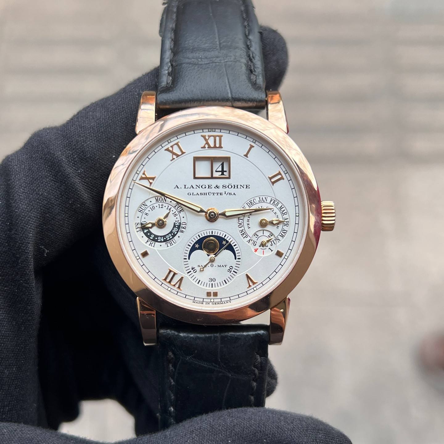 May be an image of wrist watch and text