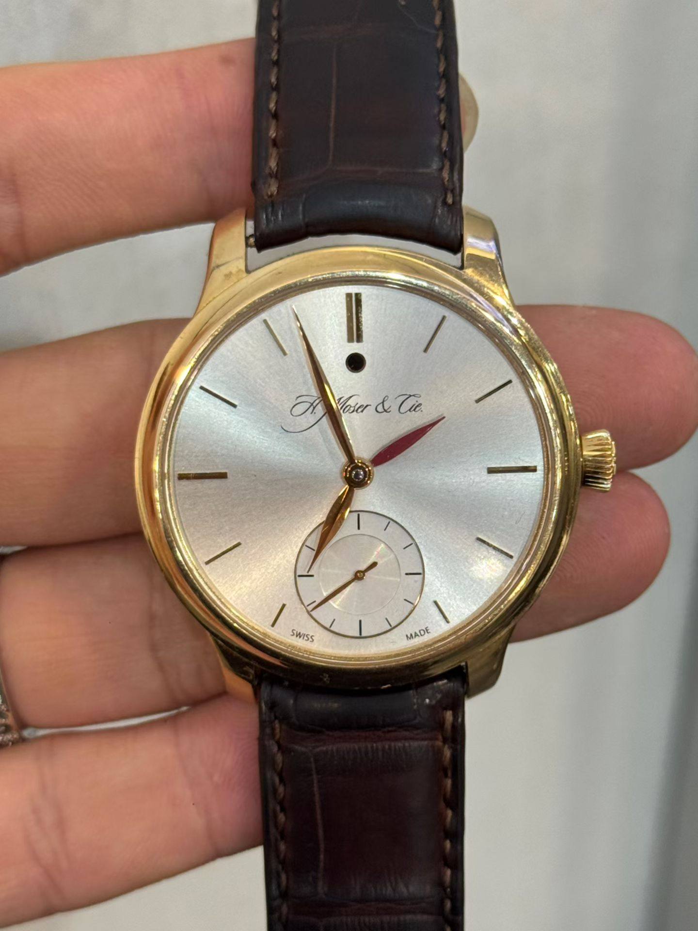May be an image of wrist watch and text
