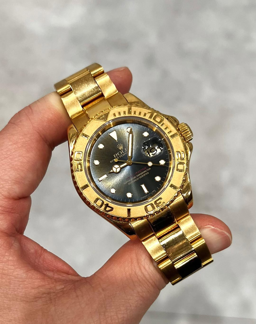 May be an image of wrist watch and text