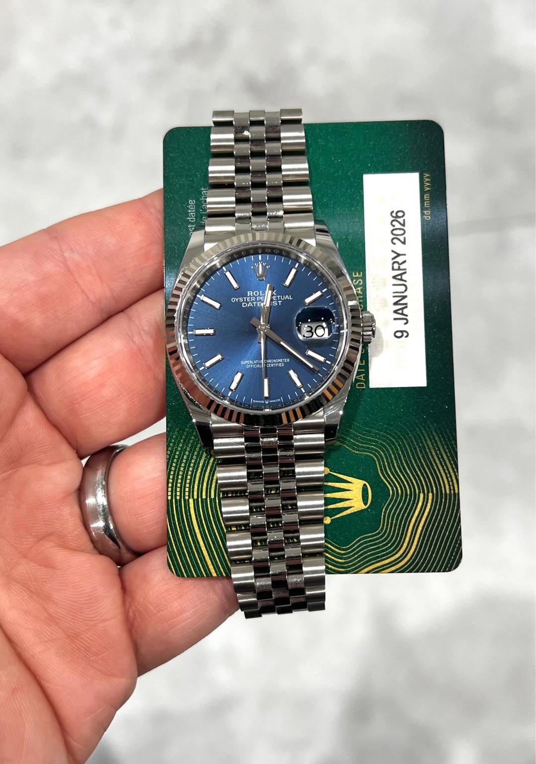 May be an image of wrist watch and text