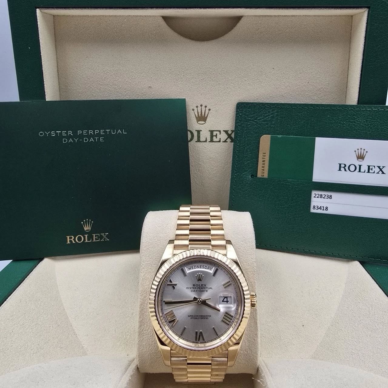 May be an image of wrist watch and text that says 'OYSTER OYSTERPERPETUAL PERPETUAL DAY-DATE DAY-DATE W1z DLE GUARANTEE Wi ROLEX ROLEX ROL E.A SEDNESAE พมายค TUMA Di Vii'