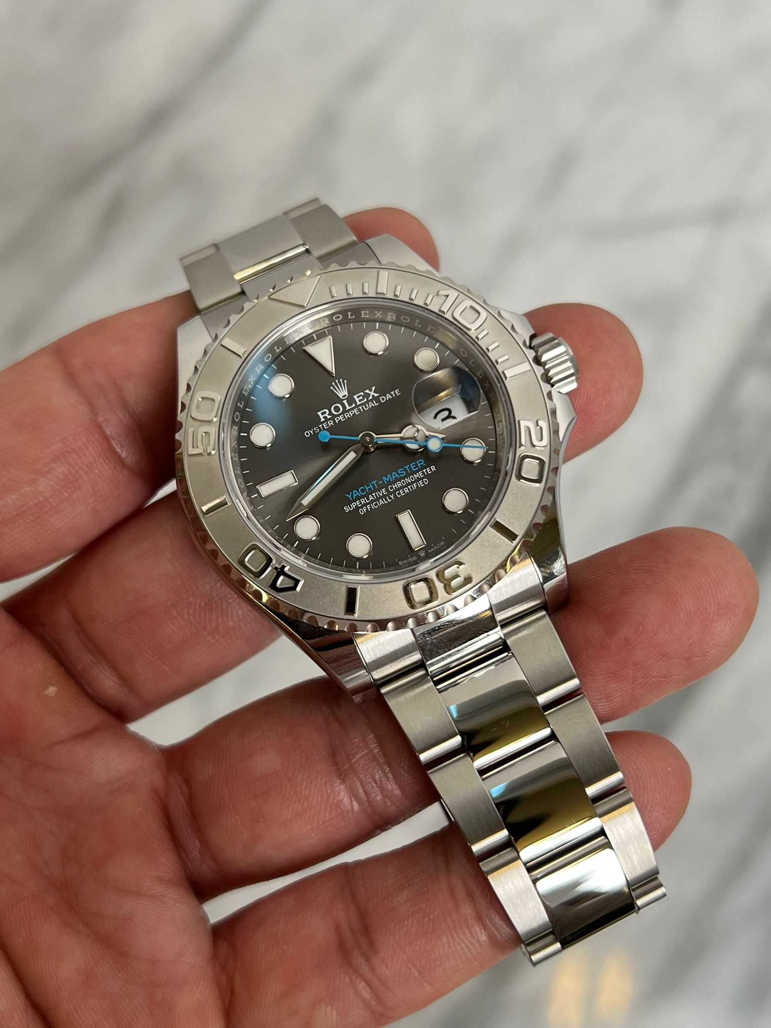 May be an image of wrist watch and text