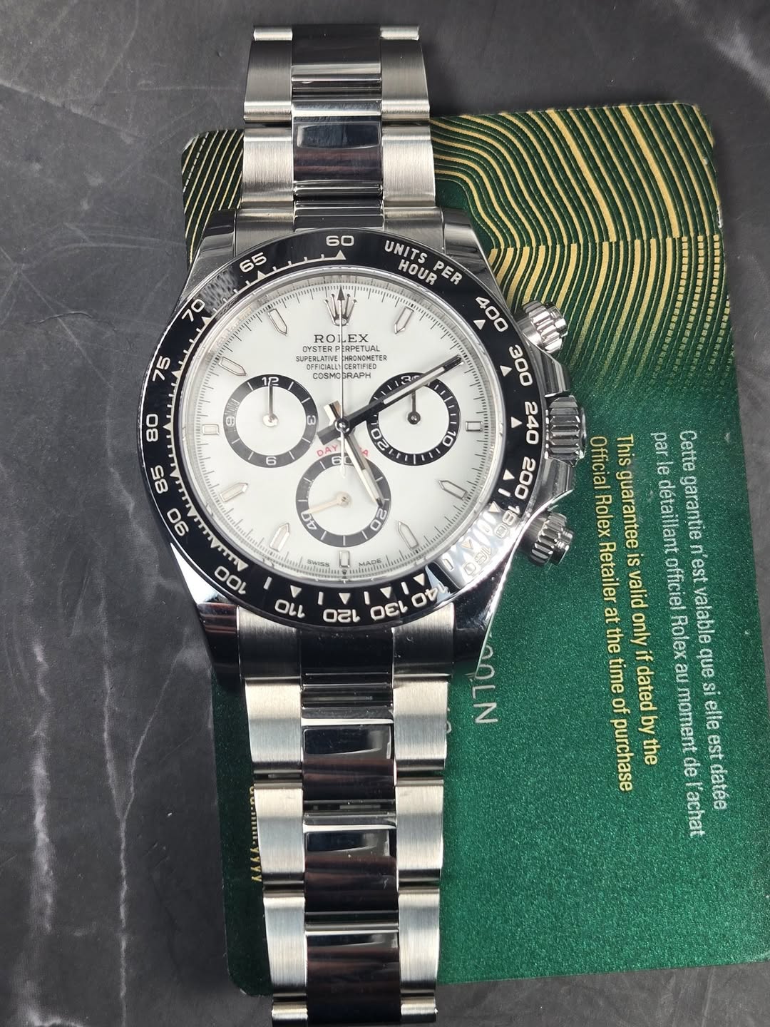 May be an image of wrist watch and text that says ' ROLLEX ESTERPEGE TERPERPETUAL . 12 CORAPH 113 UNITS HOUR PER 400 300 Ba 200 18 D ผ 1 6 E : 2) AG ญ 3 40 る 50 Official This par…