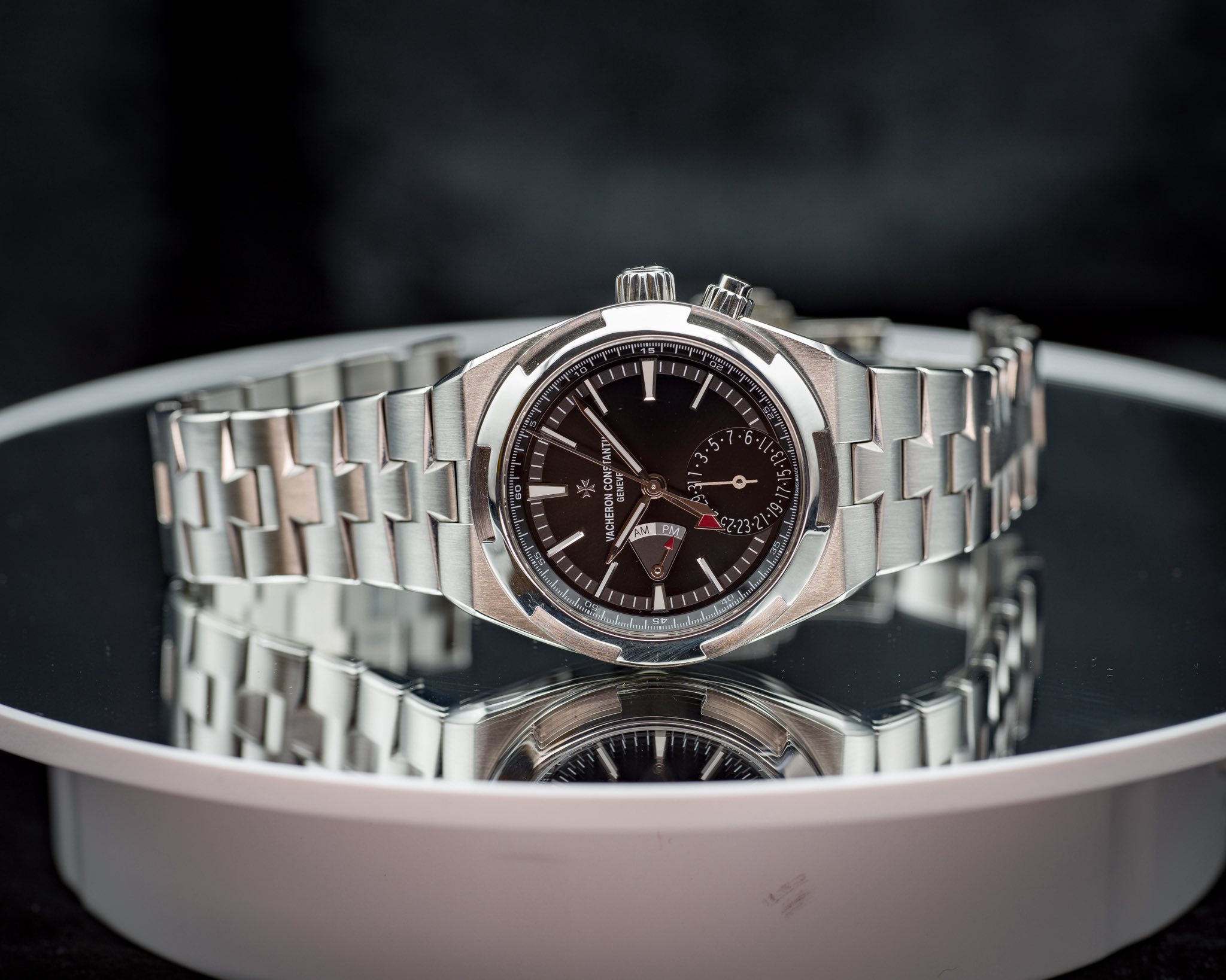 May be an image of wrist watch and text